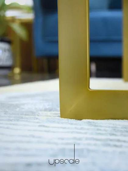 Details matter. The brushed gold finish on the leg of this coffee table adds a touch of luxury and refinement to the living room.