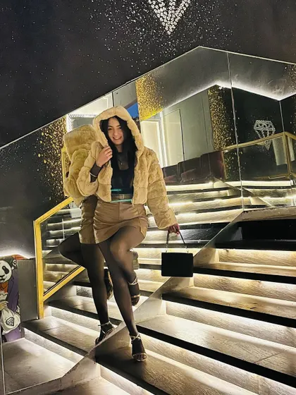 Hood up, ready to go. A playful and cozy look for a night out at the club.
