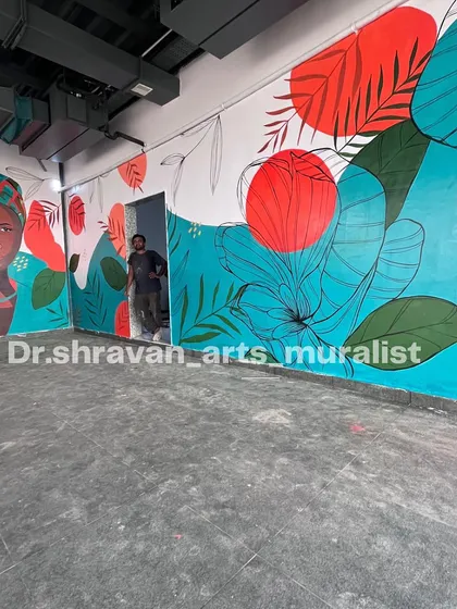 This boho art mural in Vijayawada uses bold, abstract shapes and line art. Even though the style is simple, it completely uplifts the ambience of this large, open space.