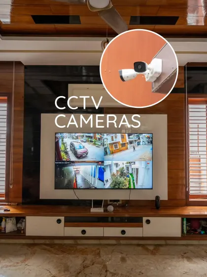 A clear view of our integrated security system. The TV displays multiple CCTV feeds, while the inset shows the outdoor cameras monitoring the property.