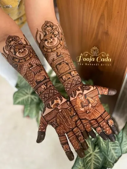 A beautiful bridal design featuring portraits of the bride and groom, along with a depiction of Lord Ganesha for blessings.