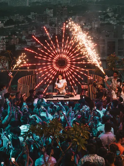 Another look at the incredible sundowner party in Nagpur. The combination of a rooftop setting, a massive crowd, and epic pyrotechnics creates an unforgettable festival DJ experience.