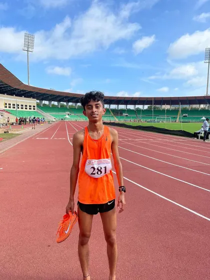 Focused and ready on the track. This young athlete went on to win a bronze medal in the 3000m race.
