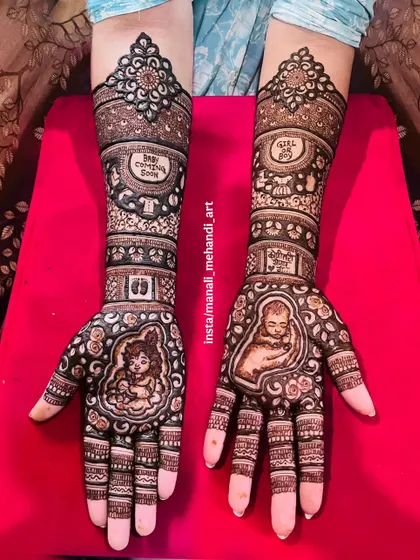 A complete baby shower mehandi design for a mother-to-be. The artwork includes portraits of baby Krishna and a sleeping newborn, along with fun elements like 'Baby Coming Soon' and 'Girl or Boy'.