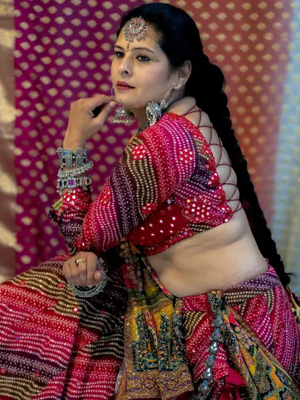 The back of my custom Garba blouse features an intricate tie-up design, ensuring the outfit is stunning from every angle.