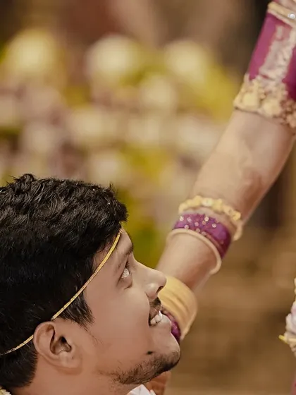 A beautiful, intimate moment from a pre-wedding ceremony. The focus is on the couple's connection, with the bride's makeup kept soft and natural to enhance the raw emotion of the shot.