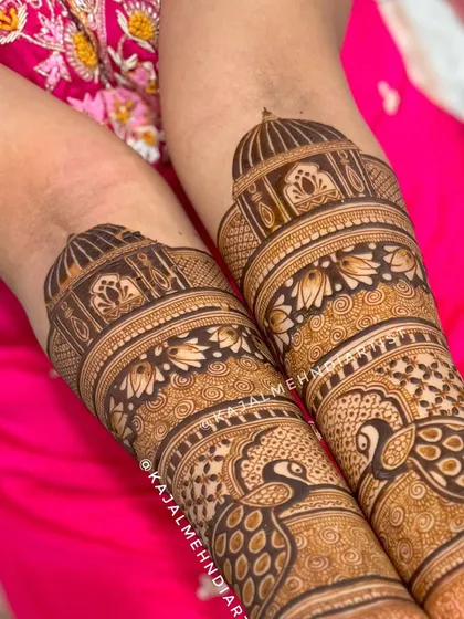 An in-progress shot of this beautiful bridal design, showing the layers of patterns on the arm.