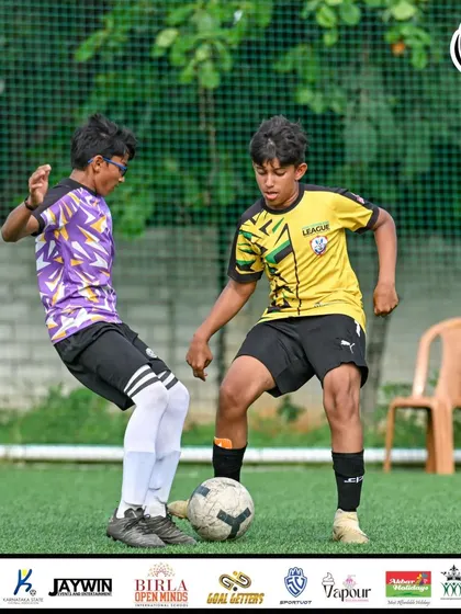 An intense 1v1 battle for possession during the U13 MDL Final.