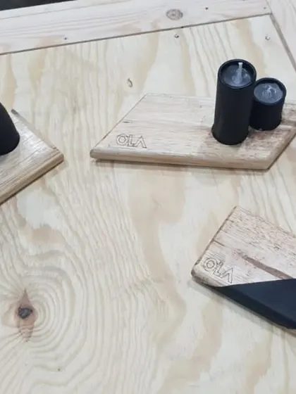 A collection of the finished desk accessories we created for the Ola Electric team. Each one is a unique piece of their company's story, handcrafted from their own industrial waste.
