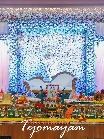 A stunning engagement stage with blue and white floral decor, creating a cool and sophisticated ambiance.