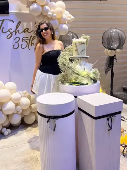 The birthday girl looking chic in front of the decor we created for her special day.