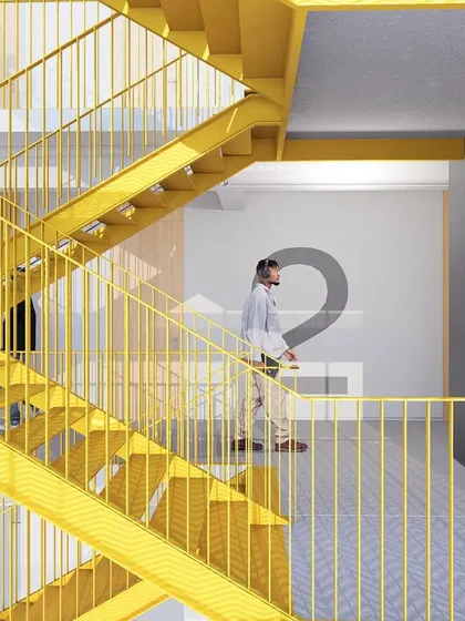 A bright yellow staircase adds a bold, energetic element to this co-living building. The design addresses the functional need for circulation while using color to create a distinct and memorable architectural identity.