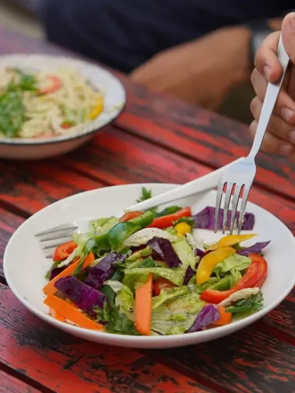 A plate full of colors to celebrate any day. Our fresh garden salad is a vibrant mix of crisp vegetables, perfect for a light and healthy meal.