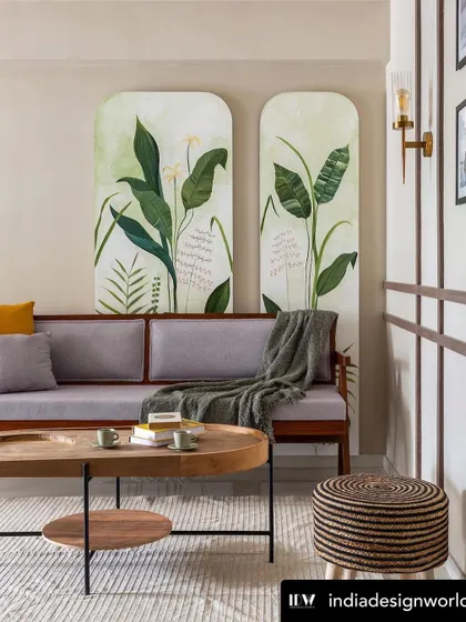 My hand-painted tropical wall panels featured in India Design World. The artwork serves as a vibrant, natural backdrop for the living room sofa, embodying the home's elegant and artistic spirit.