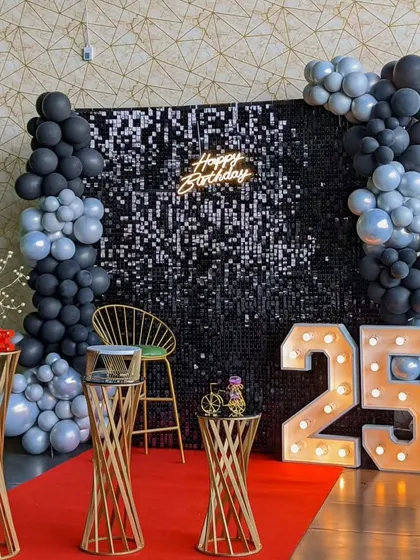 A clear view of the birthday party photo booth area, ready for guests. The setup is designed to be the center of attention and provide a fun space for everyone to take pictures and make memories.