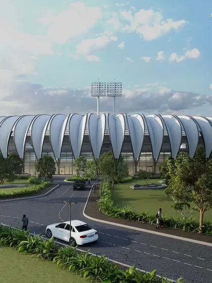 The full view of the Olympic-sized stadium, with a capacity of over 6,000. It is the centerpiece of a sprawling central plaza, designed to foster community and stand out as a unique landmark.