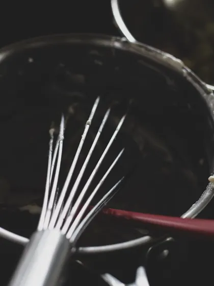 A whisk in a pot, the beginning of a sauce or a custard. Our foundational course covers essential equipment and how to use it effectively in a professional kitchen.