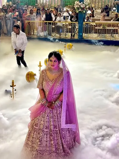 I make sure the bridal entry is a showstopper. Here, I used a fog machine and decorative matkas to create a dreamy, cloud-like path for the bride, making her entrance truly unforgettable.