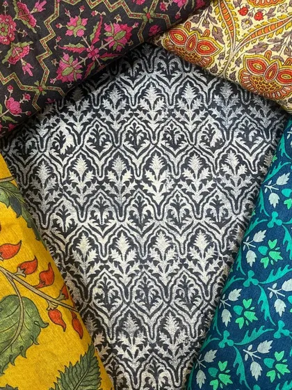 The foundation of our bespoke service is an extensive collection of the finest fabrics, allowing you to choose the perfect texture and print for your custom creation.