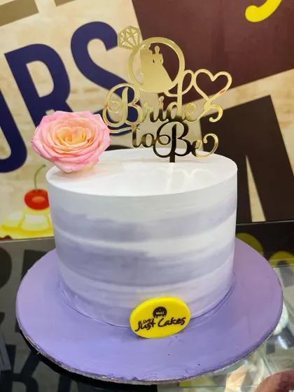 A simple and elegant 1.5kg "Bride to Be" cake with a lavender watercolor effect and a single rose.
