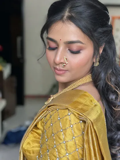 A close-up of Dr. Divyanka's engagement look, featuring soft pink eyeshadow and glowing skin.