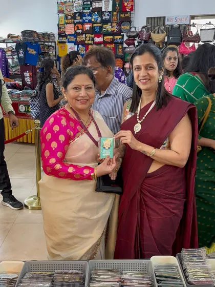 A happy customer with her purchase! Seeing these smiles is the best part of my work.