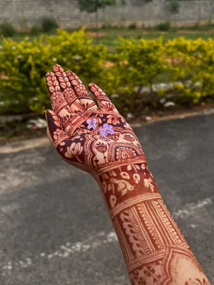 A side view of the hand, showing the beautiful stain extending up the arm.