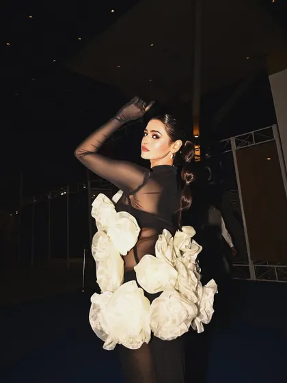 A powerful pose from backstage at Lakme Fashion Week. The sleek, structural ponytail and dramatic makeup I created helped complete this unforgettable high-fashion moment.