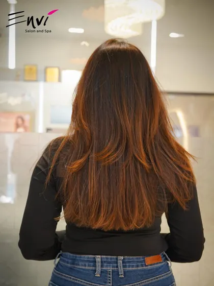 The back view of a perfectly executed layered cut. Notice the clean lines and healthy ends, the foundation of any great hairstyle.