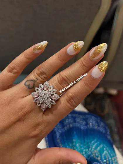 A striking design featuring a matte white base with textured gold chrome accents. The contrast between the simple white and the metallic gold creates a modern and luxurious look.