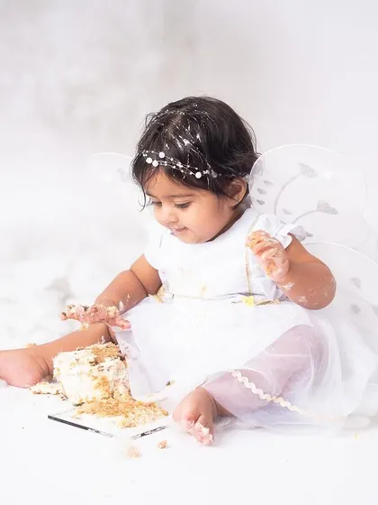 A moment of messy discovery. After the initial excitement, they often get very focused on exploring the cake, and I'm right there to document these cute, candid moments.