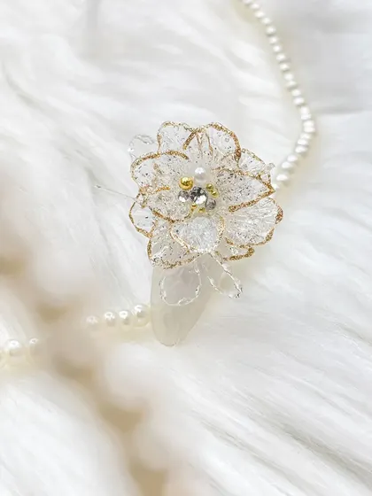 Another shot of the delicate 3D gel flower, showcasing its intricate structure against a soft, white background.