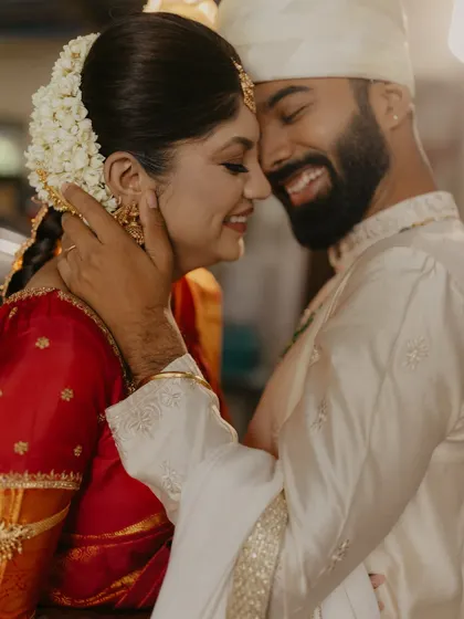 A beautiful, happy close-up of the couple embracing after their wedding ceremony.