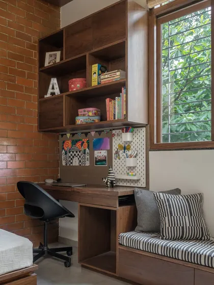 The built-in desk and overhead storage unit provide a functional workspace that doesn't compromise on style.