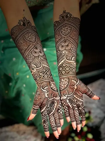 This is a stunning example of Arabic-style bridal mehndi. The bold lines, leafy vines, and use of negative space create a dramatic and beautiful effect.