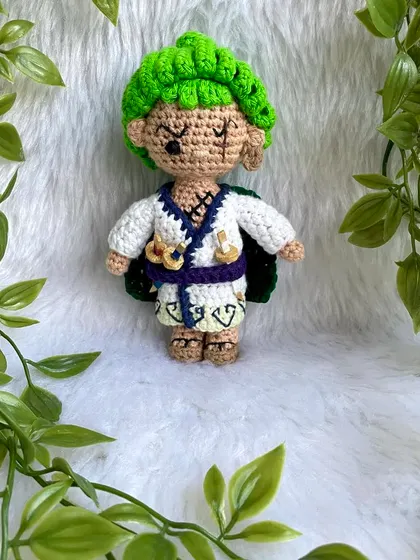 Roronoa Zoro from One Piece in a different outfit. This version features his white kimono, green cape, and of course, his three swords. It's always exciting to create new designs for a character.