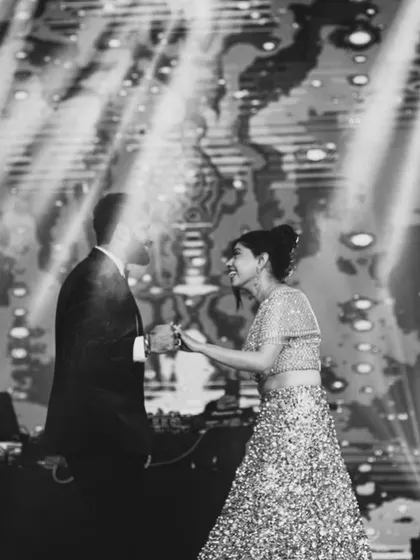 A happy, candid moment between the couple during their dance. It's these genuine interactions that truly make the performance special and memorable.