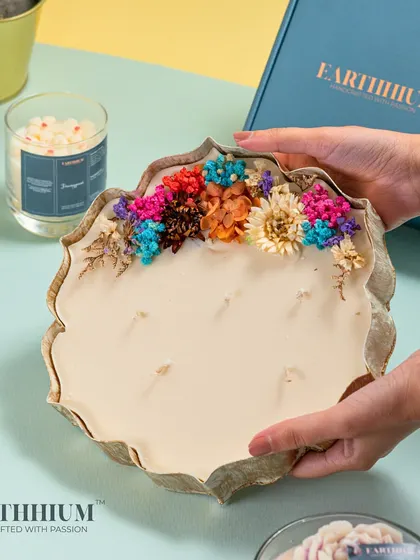 This unique candle features a wreath of real dried flowers in vibrant colors. It's a beautiful fusion of natural elements and handcrafted wax art, perfect for adding a rustic yet colorful touch.