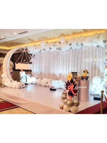 The full stage setup for the elegant white fairy party.
