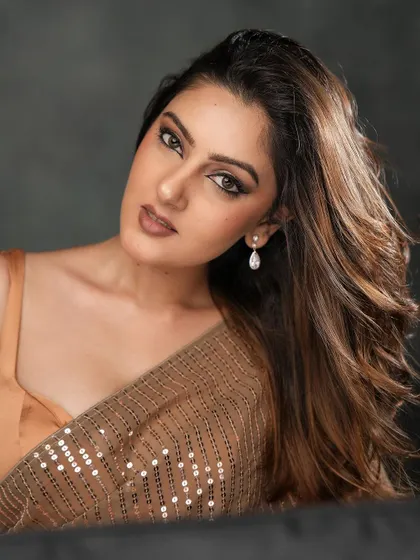 A portrait shot that highlights the beautiful winged eyeliner and soft, shimmery eyeshadow. This is a versatile glam look that works for many occasions.