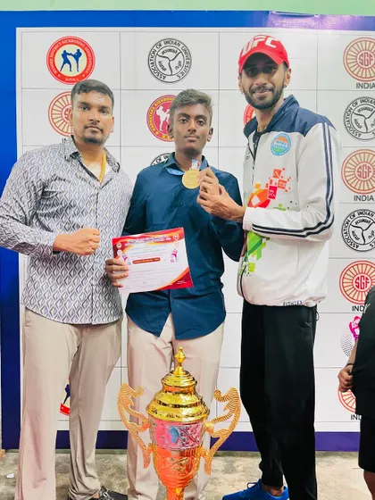 Another proud winner from our team at the state level championship. The collection of medals and the team trophy shows our collective strength.