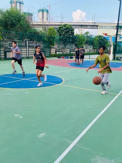A player dribbles the ball, looking for an opening.