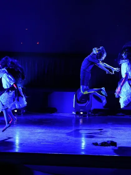 A dynamic shot of our young contemporary dancers in mid-air, creating a haunting and beautiful visual in their horror-themed piece.
