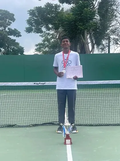 Standing proud with the finalist trophy. This achievement reflects the dedication and high-performance training he undergoes daily at our academy.