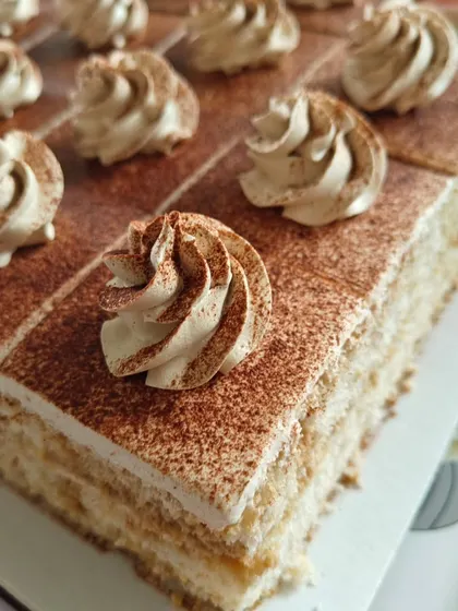 Our Tiramisu pastry is an elegant treat. Layers of coffee-soaked sponge and mascarpone cream are dusted with cocoa powder for that authentic Italian flavour.