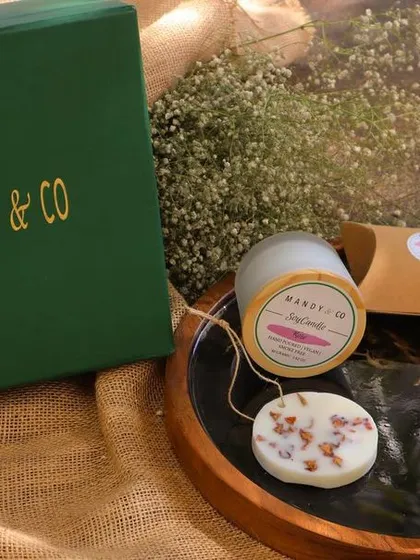 The 'Radiant Diwali Treasures Gift Box'. This hamper includes a selection of my artisanal soaps, a bubble candle, and a scented wax tablet.