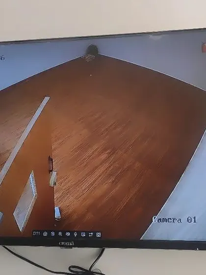 A wide-angle indoor shot showing the full coverage of a room from a corner-mounted camera.