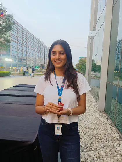 An employee from a corporate campus in Eco Space holds up her freshly made candle, a perfect little break from the workday.