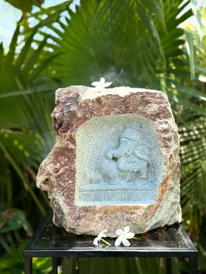 This niche carving shows Ganesha with his attendant, a beautiful piece of storytelling in stone for your garden or home.