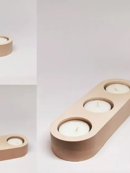 This image shows the finished products made from our multi-cavity T-light holder moulds. They create sleek, functional, and stylish holders for your tea light candles.